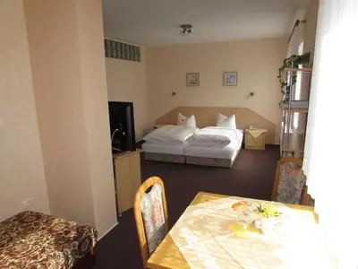 Ein Bett oder Betten in einem Zimmer der Unterkunft Pension Am Heiderand