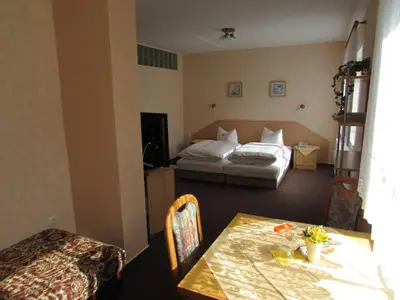 Ein Bett oder Betten in einem Zimmer der Unterkunft Pension Am Heiderand