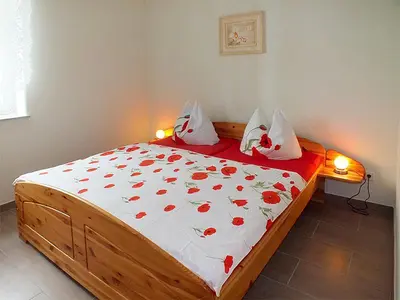 Ein Bett oder Betten in einem Zimmer der Unterkunft Ferienwohnungen 