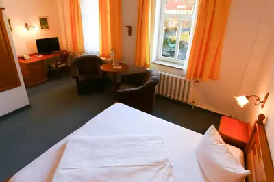 Ein Bett oder Betten in einem Zimmer der Unterkunft Parkhotel Forsthaus
