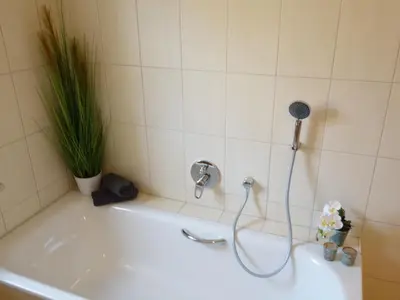Ein Badezimmer in der Unterkunft Ferienhof Gräfe - 3-Seiten Hof mit großem Garten, Pool & Sauna