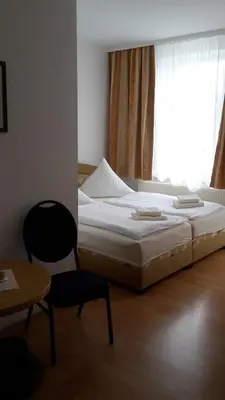 Ein Bett oder Betten in einem Zimmer der Unterkunft Pension Am Renner