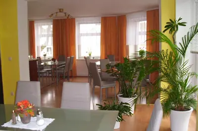 Ein Sitzbereich in der Unterkunft Pension Am Renner