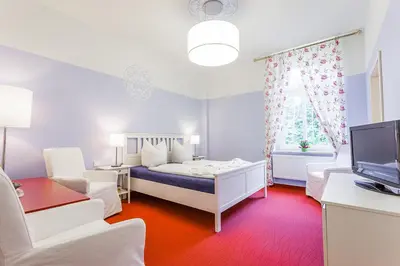 Ein Bett oder Betten in einem Zimmer der Unterkunft Parkhotel Muldental