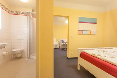 Ein Bett oder Betten in einem Zimmer der Unterkunft Parkhotel Muldental