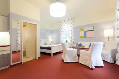 Ein Bett oder Betten in einem Zimmer der Unterkunft Parkhotel Muldental