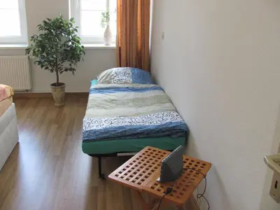 Ein Bett oder Betten in einem Zimmer der Unterkunft Ferienwohnung Voss 2