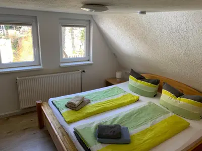 Ein Bett oder Betten in einem Zimmer der Unterkunft Haus Bergfriede