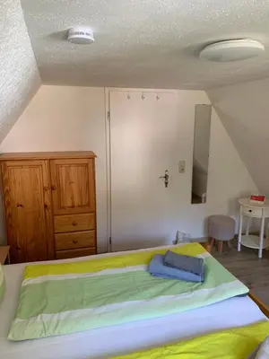 Ein Bett oder Betten in einem Zimmer der Unterkunft Haus Bergfriede