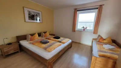Ein Bett oder Betten in einem Zimmer der Unterkunft Ferienhof Lilienstein