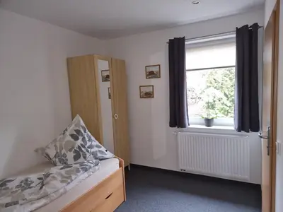 Ein Bett oder Betten in einem Zimmer der Unterkunft Pension 