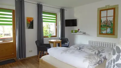 Ein Bett oder Betten in einem Zimmer der Unterkunft Pension 