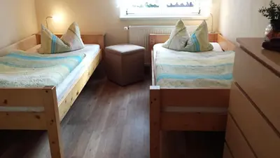 Ein Bett oder Betten in einem Zimmer der Unterkunft Ferienwohnung Am Elbradweg
