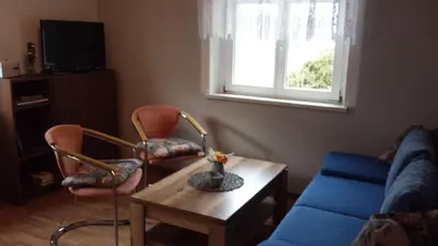 Ein Sitzbereich in der Unterkunft Ferienwohnung Am Elbradweg