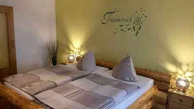 Ein Bett oder Betten in einem Zimmer der Unterkunft Landgasthof Dittersdorfer Höhe