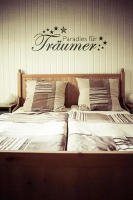 Ein Bett oder Betten in einem Zimmer der Unterkunft Landgasthof Dittersdorfer Höhe