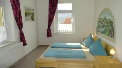 Ein Bett oder Betten in einem Zimmer der Unterkunft Ferienwohnung 