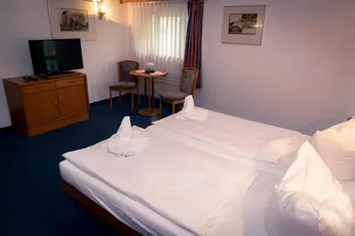 Ein Bett oder Betten in einem Zimmer der Unterkunft Börse Coswig