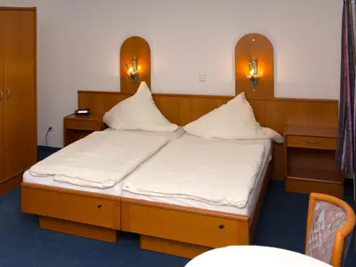 Ein Bett oder Betten in einem Zimmer der Unterkunft Börse Coswig