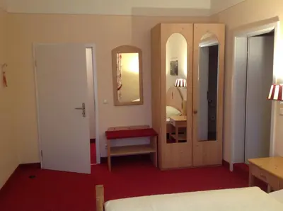 Ein Bett oder Betten in einem Zimmer der Unterkunft bei Zwillings Hotel & Restaurant