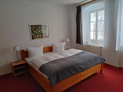 Ein Bett oder Betten in einem Zimmer der Unterkunft Hotel Blaue Blume