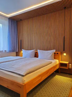 Ein Bett oder Betten in einem Zimmer der Unterkunft Pension Am Nationalpark