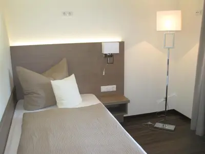 Ein Bett oder Betten in einem Zimmer der Unterkunft Heidepension Anja