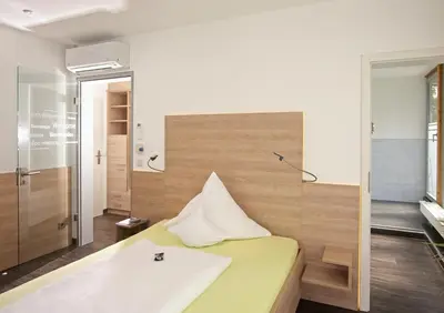 Ein Bett oder Betten in einem Zimmer der Unterkunft Hotel Forsthaus Grüna Betreibergesellschaft mbH