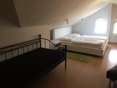 Ein Bett oder Betten in einem Zimmer der Unterkunft Ferienwohnung Tonberg 4
