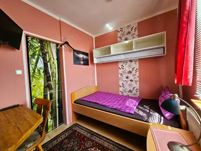 Ein Bett oder Betten in einem Zimmer der Unterkunft Pension Zur Kutscherstube