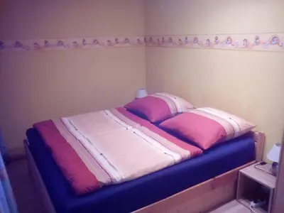 Ein Bett oder Betten in einem Zimmer der Unterkunft Ferienwohnung Eulitz