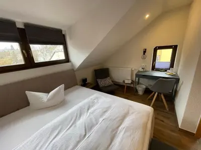 Ein Bett oder Betten in einem Zimmer der Unterkunft Avenue Das Gästehaus