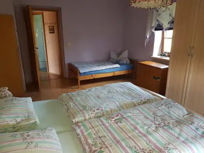 Ein Bett oder Betten in einem Zimmer der Unterkunft Strasse des Friedens