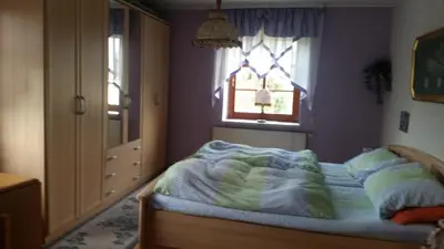 Ein Bett oder Betten in einem Zimmer der Unterkunft Strasse des Friedens