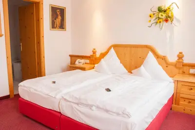 Ein Bett oder Betten in einem Zimmer der Unterkunft Elbhotel Bad Schandau