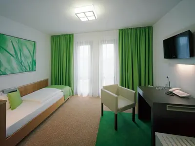 Ein Bett oder Betten in einem Zimmer der Unterkunft Akademiehotel Dresden