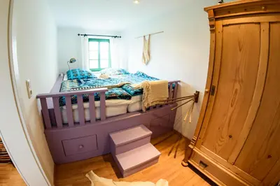 Ein Bett oder Betten in einem Zimmer der Unterkunft Traumhaftes Elb-Chalet