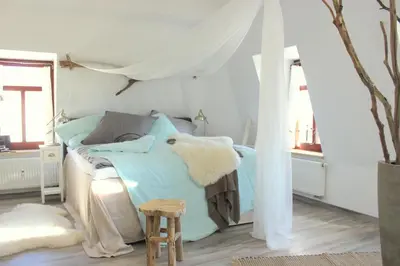 Ein Bett oder Betten in einem Zimmer der Unterkunft Loft im Turmhaus am Weissen Hirsch