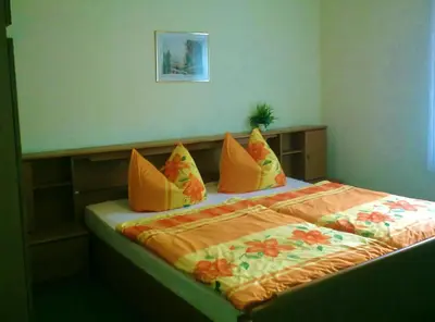 Ein Bett oder Betten in einem Zimmer der Unterkunft Ferienwohnung Herpich