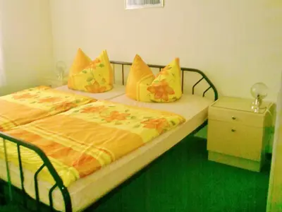 Ein Bett oder Betten in einem Zimmer der Unterkunft Ferienwohnung Herpich
