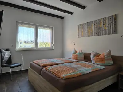 Ein Bett oder Betten in einem Zimmer der Unterkunft Ferienwohnungen 