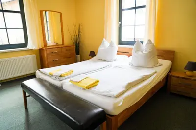 Ein Bett oder Betten in einem Zimmer der Unterkunft Herberge Zum Steiger Franz