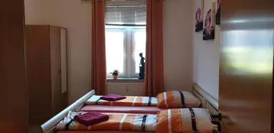 Ein Bett oder Betten in einem Zimmer der Unterkunft Gasthaus Pavillon