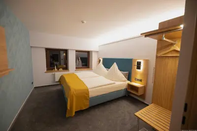 Ein Bett oder Betten in einem Zimmer der Unterkunft Landhotel Zur Guten Einkehr