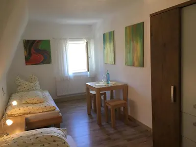 Ein Bett oder Betten in einem Zimmer der Unterkunft Ferienwohnung Richtermühle