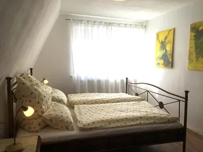 Ein Bett oder Betten in einem Zimmer der Unterkunft Ferienwohnung Richtermühle