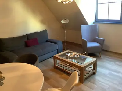 Ein Sitzbereich in der Unterkunft Ferienwohnung Himmel und Hölle
