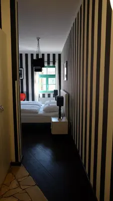 Ein Bett oder Betten in einem Zimmer der Unterkunft Backstage Hotel