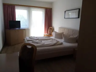 Ein Bett oder Betten in einem Zimmer der Unterkunft Hotel zum Jahnatal