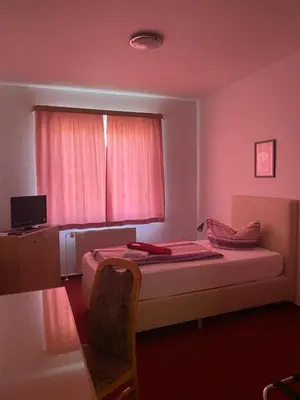 Ein Bett oder Betten in einem Zimmer der Unterkunft Hotel zum Jahnatal